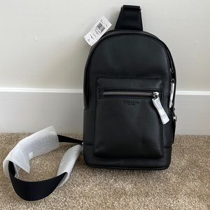 Small black Coach book bag. Brand New!